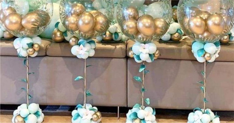 centro de mesa para cha de bebe com balões dourados